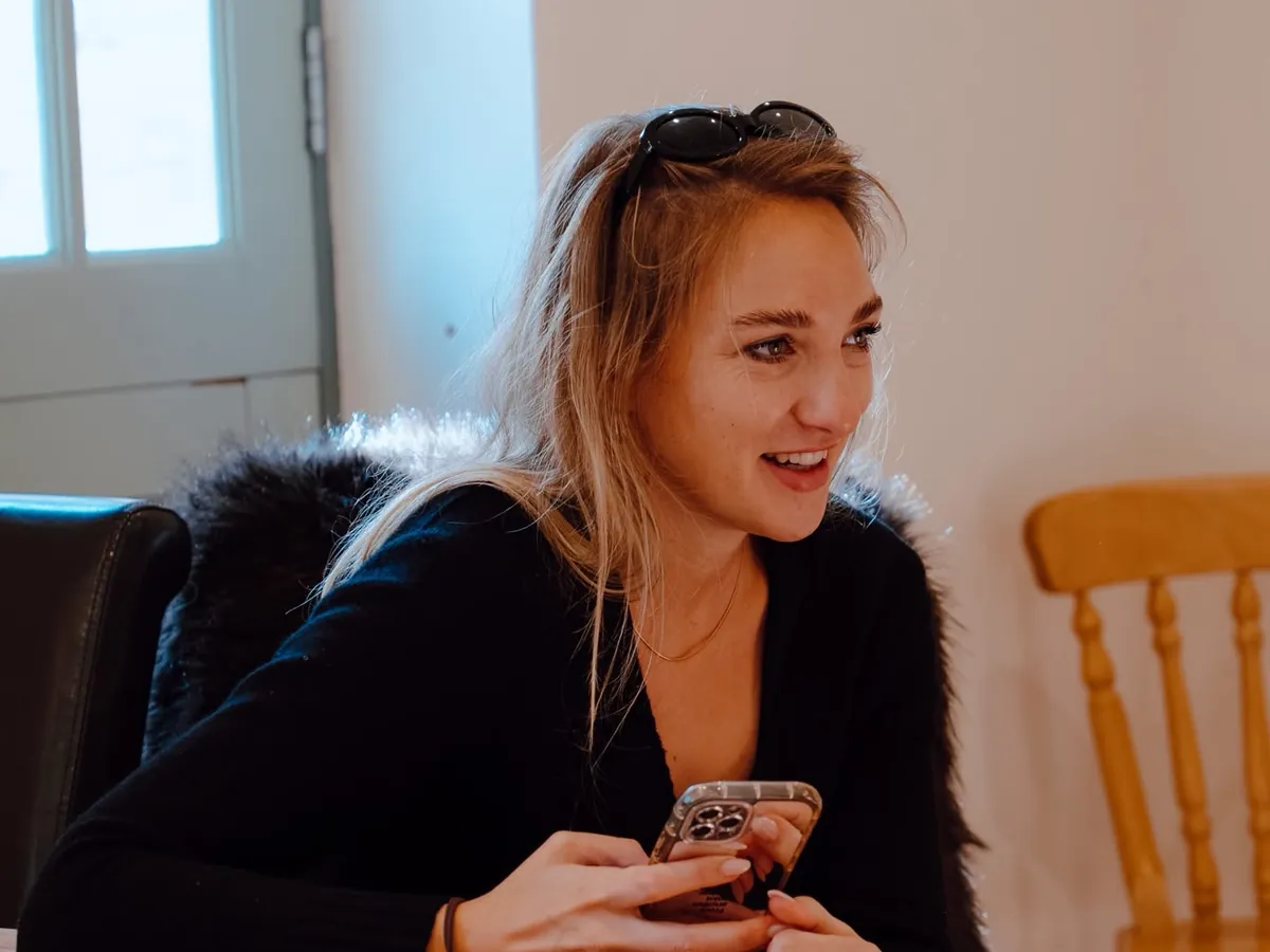 A smiling woman chatting at the table during Circle 2.0, The Cycle Edition